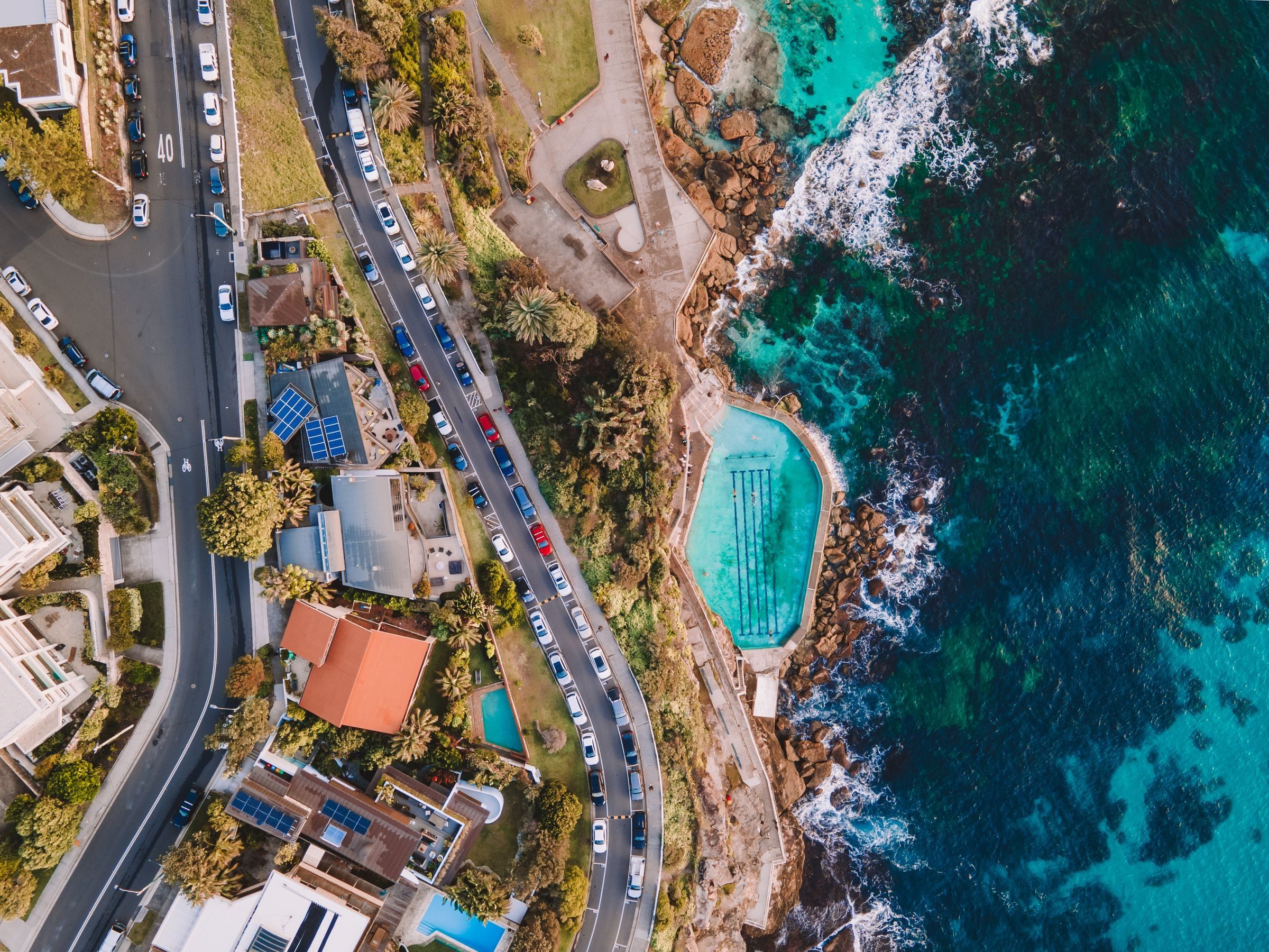 Bronte Baths, the ocean pool at the south end of Bronte Beach, seen from above with the coastal road behind