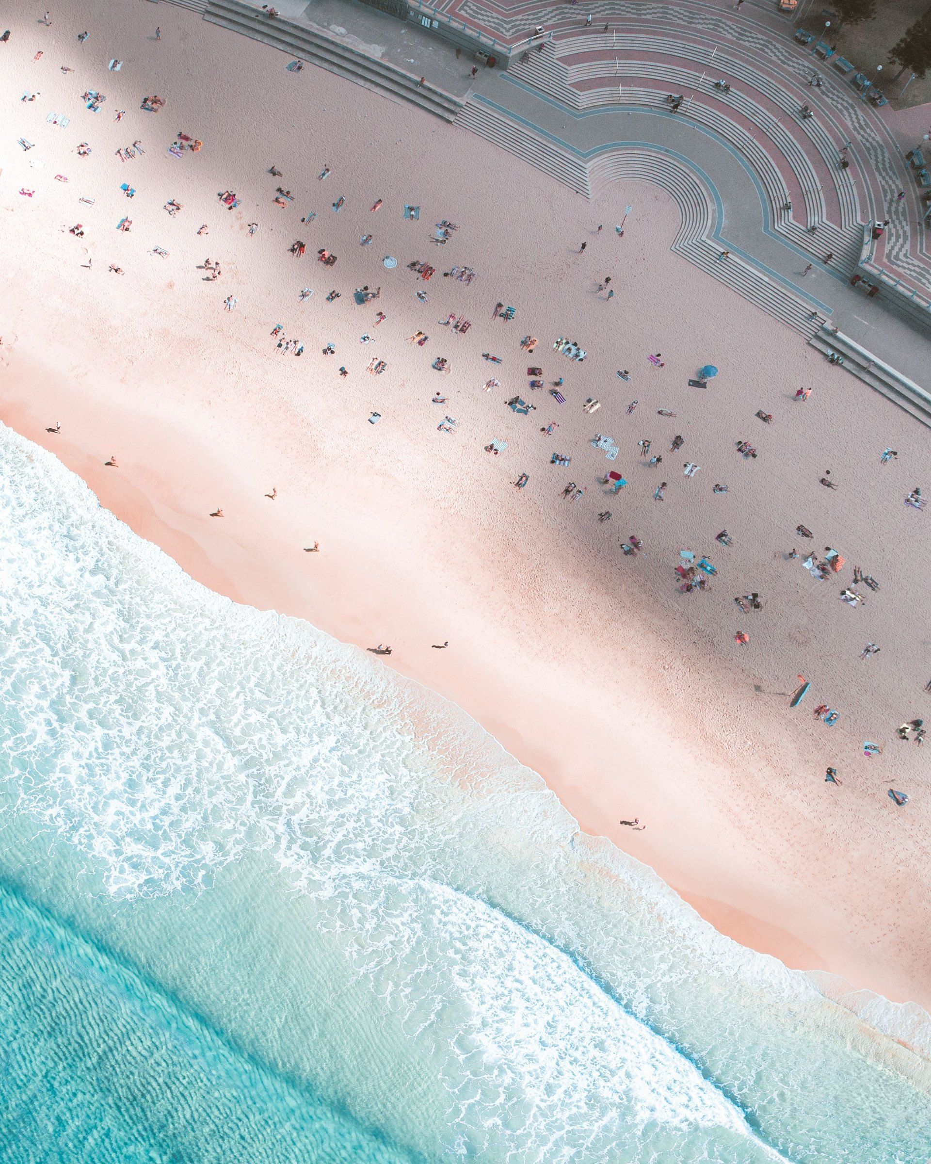 The middle of Coogee Beach from above, people on the sand