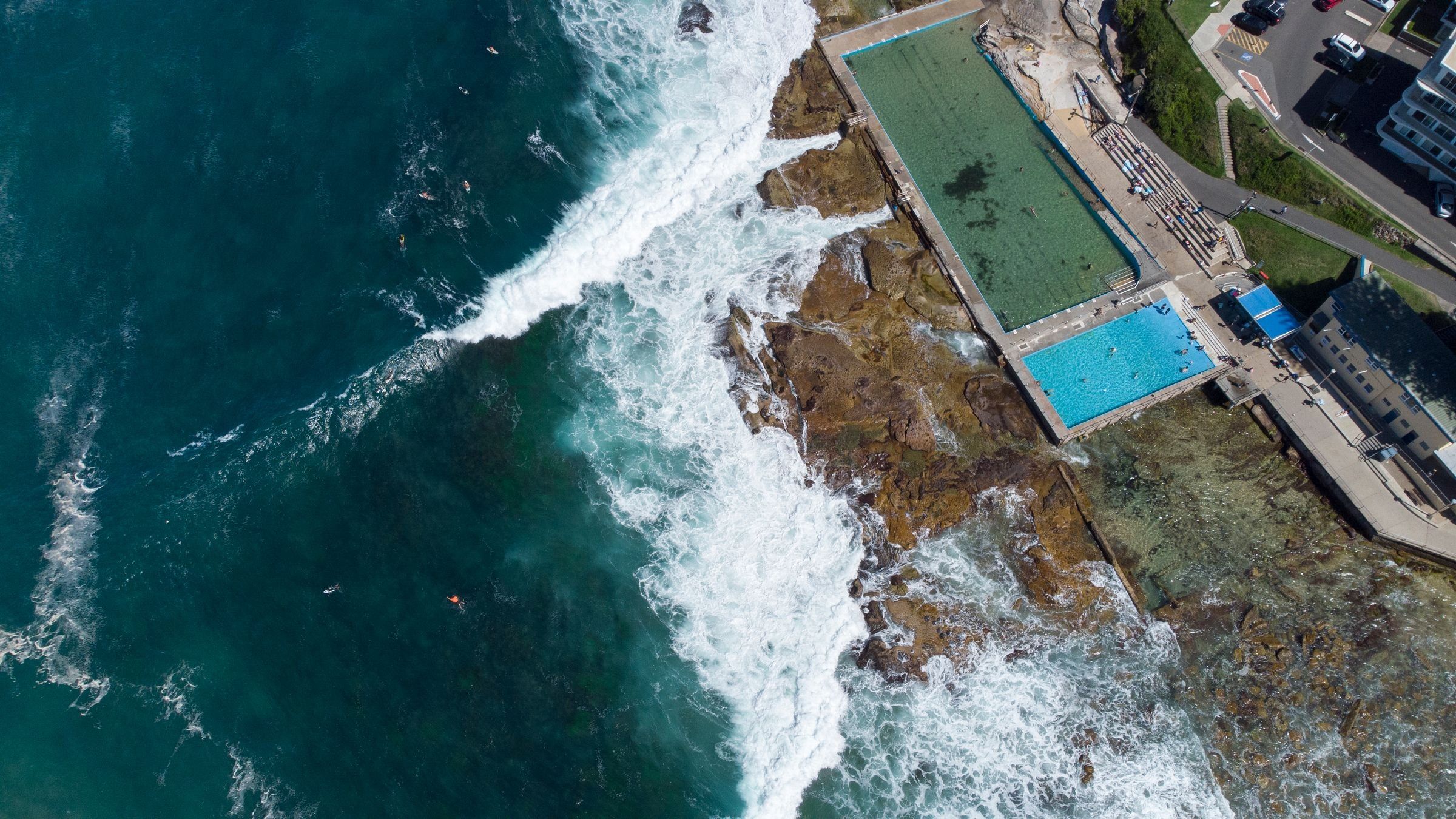 The Dee Why ocean pools on the rocks at the south end of the beach, seen from above