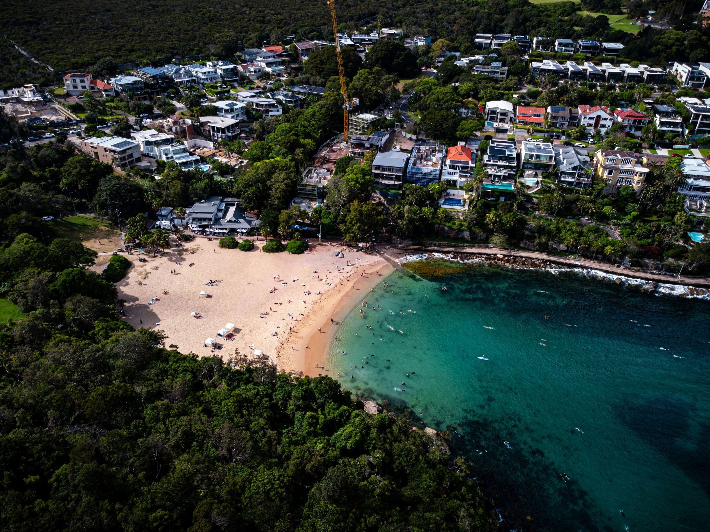 Shelly Beach and Cabbage Tree Bay at Manly from above, clear green water by the sand