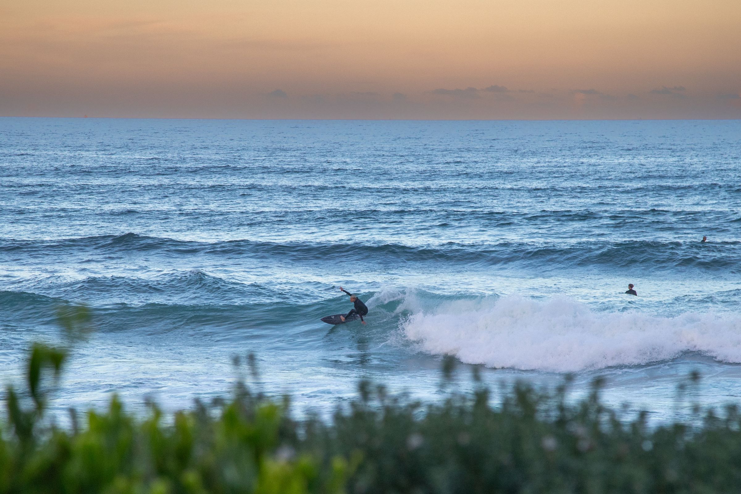 Surfer at Cronulla at sunset