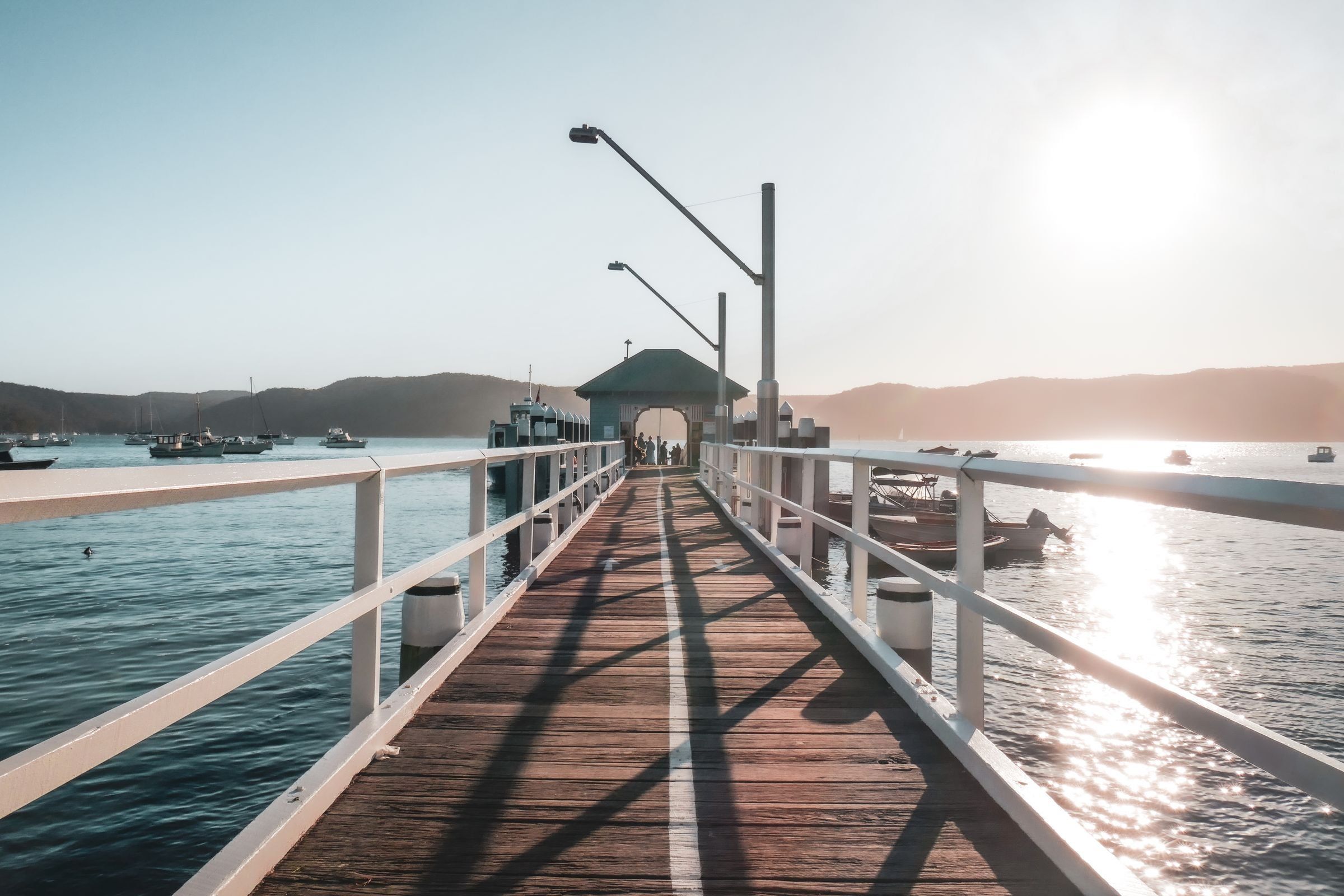 The Palm Beach wharf on Pittwater, boats moored off the jetty