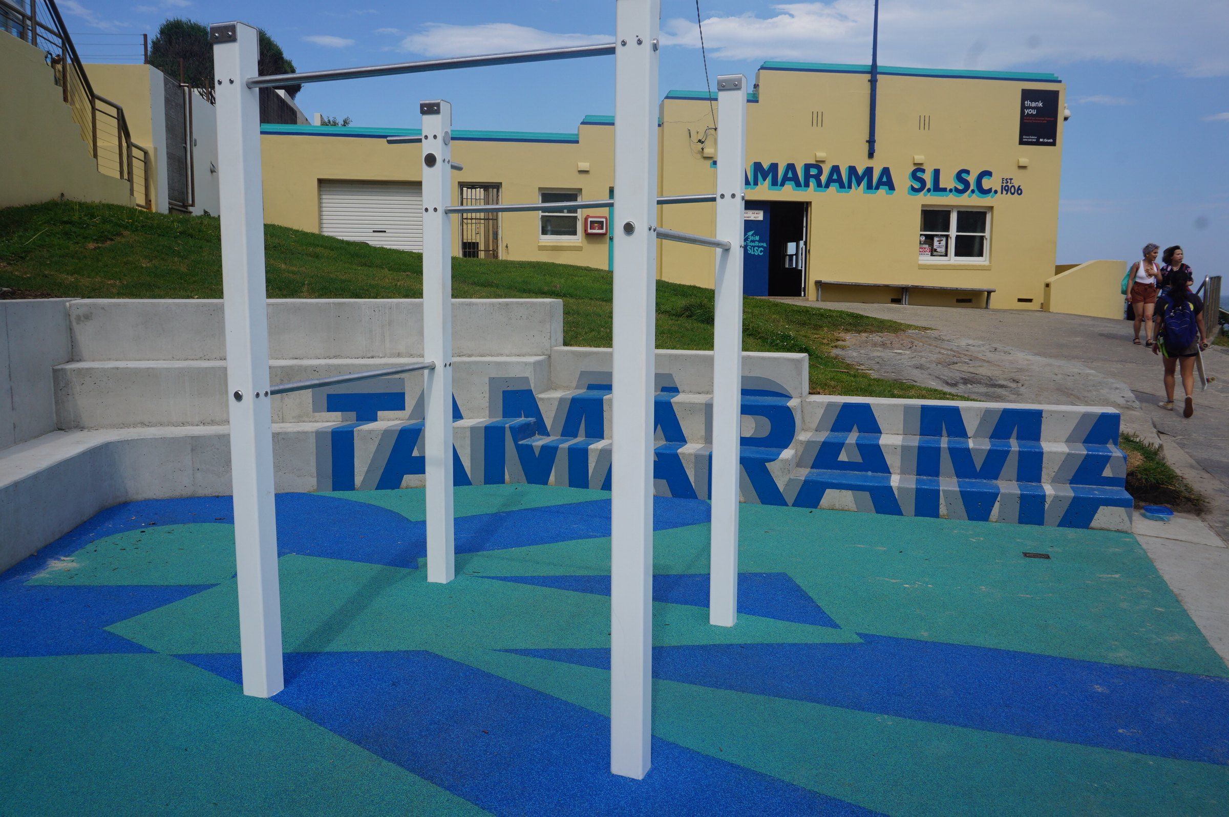 The Tamarama Surf Life Saving Club building and the outdoor gym in the park behind the beach